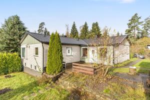 a house with a garden in front of it at Peaceful holiday home surrounded by nature in Töllsjö