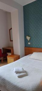 Postel nebo postele na pokoji v ubytování Hotel Nuovo Rondò