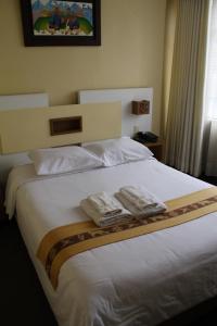 Kaaro Hotel Puno客房内的一张或多张床位
