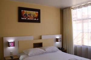 Kaaro Hotel Puno客房内的一张或多张床位