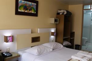 Kaaro Hotel Puno客房内的一张或多张床位