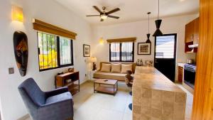 a living room with a couch and a table at San Angel Villas in San Antonio