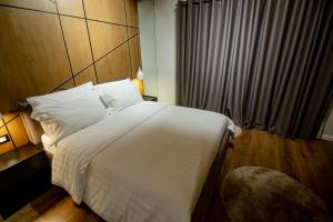 Postel nebo postele na pokoji v ubytování Tree Hotel