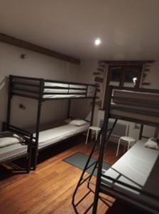 a room with two bunk beds and a ladder at La vita e bella in Saint-Jean-Pied-de-Port