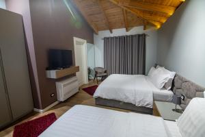 Postel nebo postele na pokoji v ubytování Tree Hotel