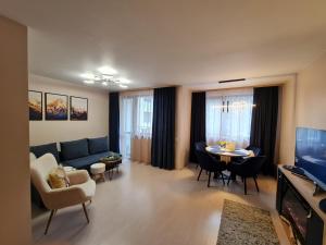 TV a/nebo společenská místnost v ubytování Mountain Peak Apartment