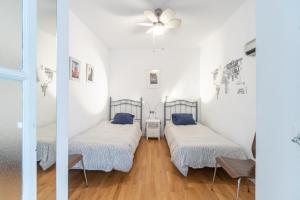 Voodi või voodid majutusasutuse Apartamento Sweet Home in Cádiz toas