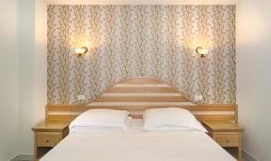 Postel nebo postele na pokoji v ubytování Hotel Nedy