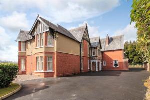 an image of a house with a driveway at Country Mansion - Private Annexe in Llanwrda