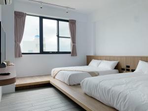 Letto o letti in una camera di 澎湖旅澄民宿 ph880Journey