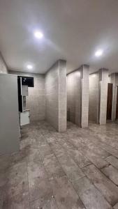an empty bathroom with tile walls and a tiled floor at MyNest1103A@SweetHome in Melaka