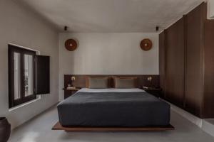 Ένα ή περισσότερα κρεβάτια σε δωμάτιο στο Casa Cook Mykonos - Adults Only
