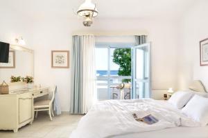 A bed or beds in a room at Perigiali