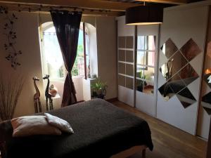 Postel nebo postele na pokoji v ubytování Maison paisible
