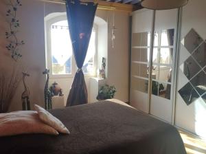 Postel nebo postele na pokoji v ubytování Maison paisible