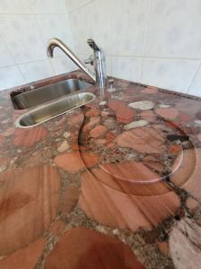 a kitchen counter with a sink on top of it at Apartment Ferrari in Portorož