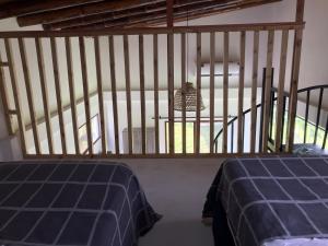 Postel nebo postele na pokoji v ubytování Las Cabañas