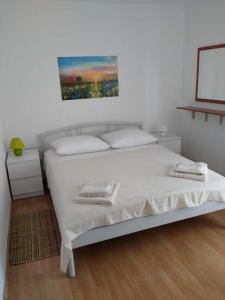 Postel nebo postele na pokoji v ubytování Blaža