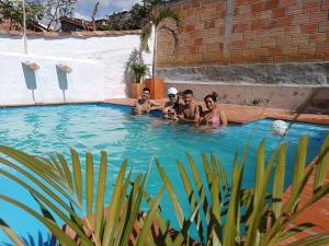 a group of people in a swimming pool at The Best Adventure Hostel in San Gil