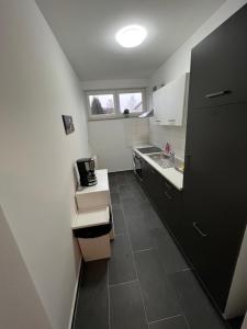 Η κουζίνα ή μικρή κουζίνα στο Wohnung in Troisdorf T03