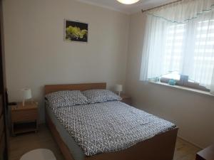 Postel nebo postele na pokoji v ubytování Domek na wzgórzu