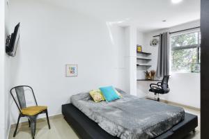 TV a/nebo společenská místnost v ubytování International House Co-Living