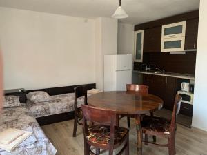 a kitchen with a table and chairs in a room at Sozopol Old Town - Apartment 4 in Sozopol