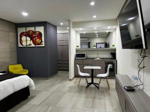 TV a/nebo společenská místnost v ubytování Madison Suites
