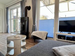 TV a/nebo společenská místnost v ubytování Ferienhaus-Simone