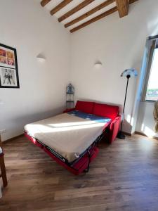 a room with a bed in the corner of a room at Il Garibaldino in Livorno