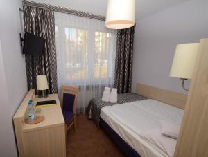Posteľ alebo postele v izbe v ubytovaní Hotel PZMot