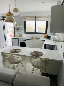 A kitchen or kitchenette at Vixen Apartment