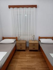 Postel nebo postele na pokoji v ubytování Apartments Raos