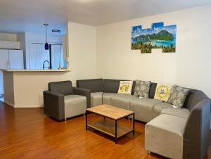 a living room with a couch and a table at House vacation near downtown Dallas in Dallas