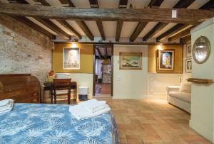 a bedroom with a bed and a living room at Ca' Rielo in Venice