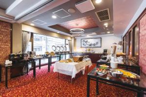 a room with a hair salon with a table at Hotel Sun White in Osaka