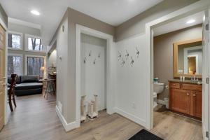 a room with a bathroom with a toilet and a sink at 728 Disciples Village Condo in Boyne Falls +10 photos