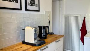 a coffee maker on a counter in a kitchen at Quiet 2 room garden loft with terrace in Bad Tölz