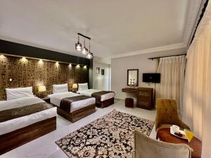 Ένα ή περισσότερα κρεβάτια σε δωμάτιο στο New Museum Guest House, Pyramids View +131 φωτογραφίες