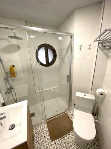 a bathroom with a shower and a toilet and a sink at Plaza de España independent house in Barcelona +47 photos