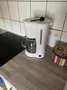 a white blender sitting on top of a counter at B1 Ith Apartment in Coppenbrügge