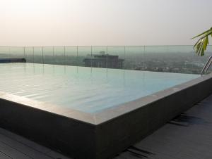 a large swimming pool on top of a building at Piano and Gold at The Lennox, Airport Residential in Accra