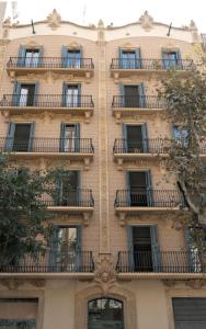 a building with balconies on the side of it at Vale Suites in Barcelona
