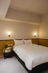Postel nebo postele na pokoji v ubytování Giant Rich Hotel