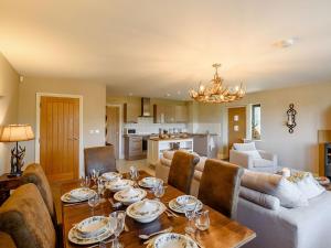 a dining room and living room with a table and chairs at The Haven - Uk38739 in Barlow