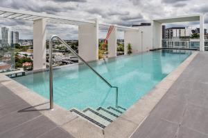 a swimming pool on the roof of a building at Two bedroom apartment on Ann Street Fortitude Valley By Serain Residences in Brisbane