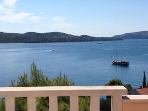 a boat in a large body of water at Villa Tonina in Trogir