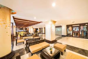 a living room with couches and tables and a lobby at Mountain Beach Resort & Convention Center in Pattaya South