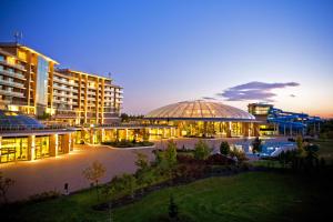 a view of a building with a domed roof at night at Aquaworld Resort Budapest in Budapest