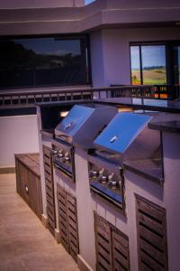 a kitchen with an island in a house at Zimbali Lakes Boulevard Suites in Ballito